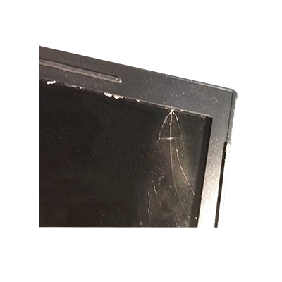 Close up of the corner of a laptop with screen damage